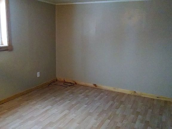 Medium sized bedroom with hard floors!