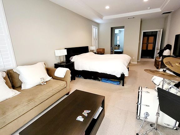 The spacious master bedroom that leads to the master bath. The drum set will not be there.