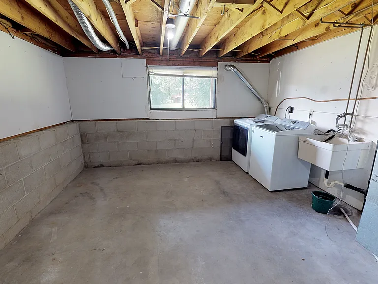 Laundry area and storage space in the basement