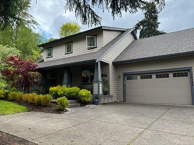 front of house and two car garage and ample off street parking