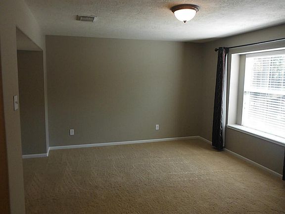 Great formal dining room with clean, neutral paint & fresh paint. Large windows allowing lots of sunlight in.