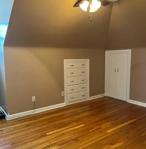 Bedroom with built in drawers, two spacious closets and an additional attic closet.