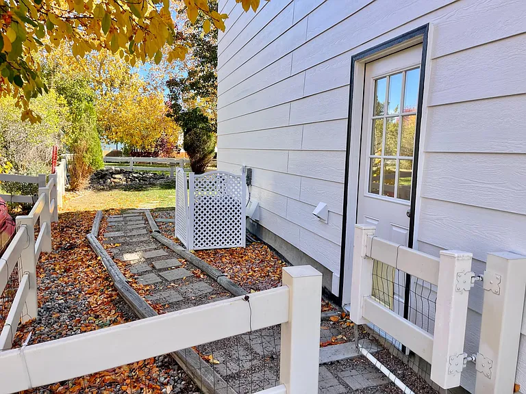 Side yard with convenient access door to garage