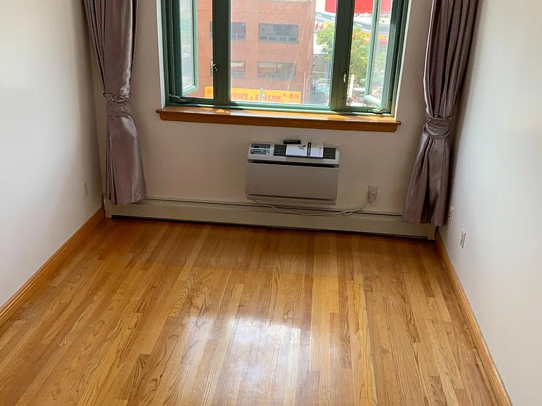 Large window with two openings in the master bedroom, also comes with a AC