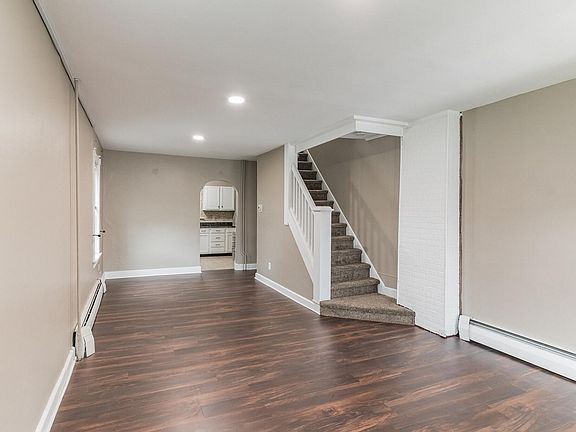 First Floor Showing Stairs to Second Level and Kitchen Entry