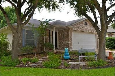 Lots of added additions-Full Gutters, Solar Screens, Storm doors