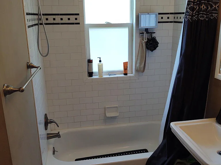 Main Floor Full Bathroom with Large Storage Closet.