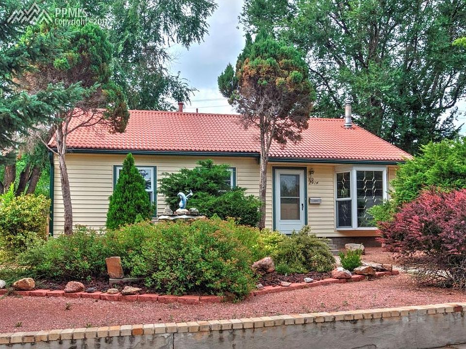Delightful ranch home with fully landscaped front yard and durable metal roof