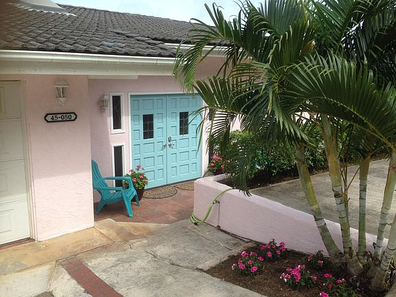 Double door entry to the home, with attached 2 car garage and ample guest parking on property.