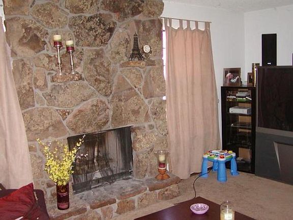 Wood Burning Moss Rock Fireplace