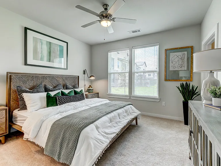 Guest bedroom with a king sized bed and walk-in closet