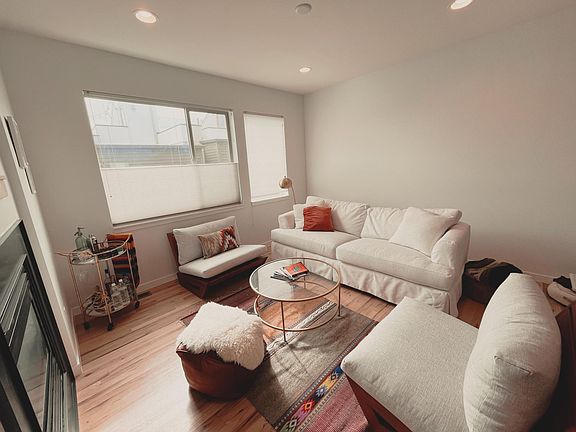 Sunny living room with gas powered fireplace