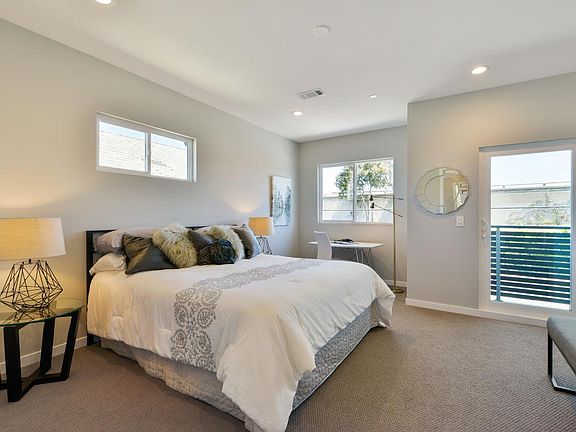 Master bedroom suite with walk-in closet and balcony