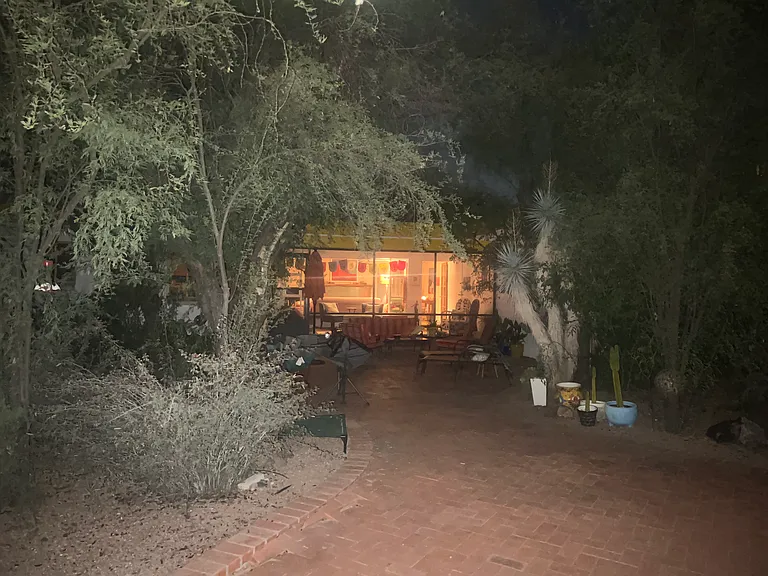 View of the inside at night from the backyard.