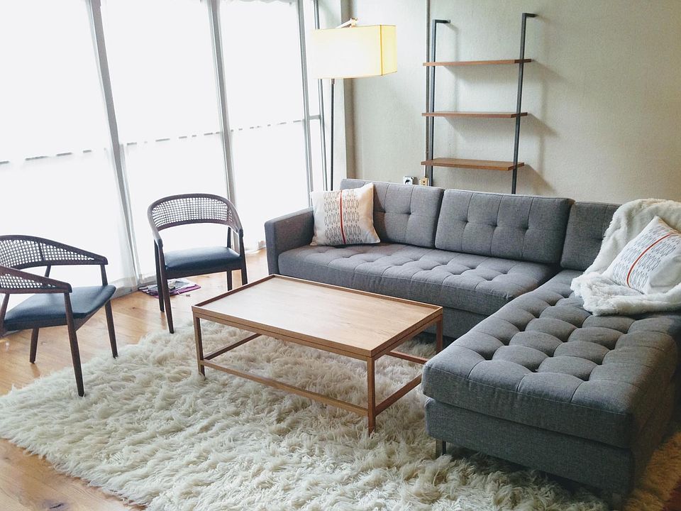 Large open living space with a wall of windows. This loft is