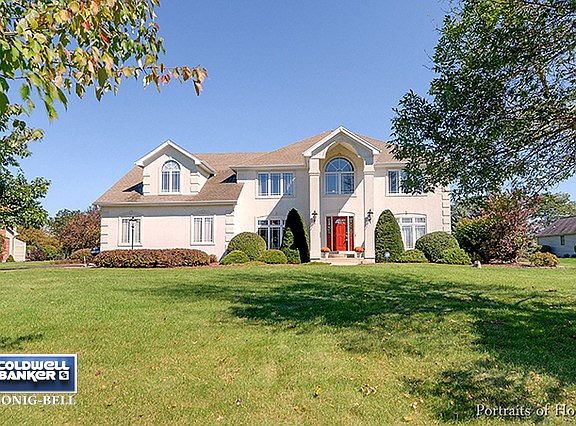 Home located on over 1 acre of land with park like setting in a quiet neighborhood.