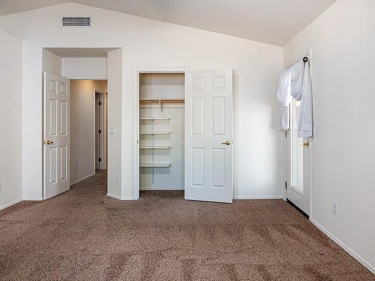 master bedroom, door to patio - two closets (walking closed on left not visible)