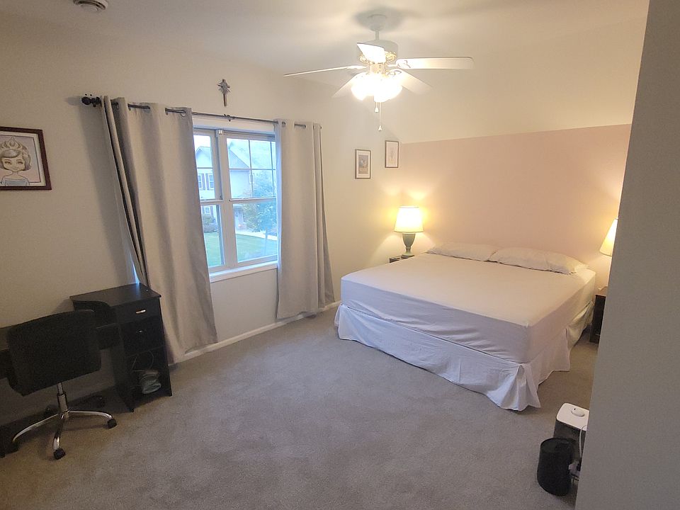 2nd Bedroom. Placed is a King Bed for size reference