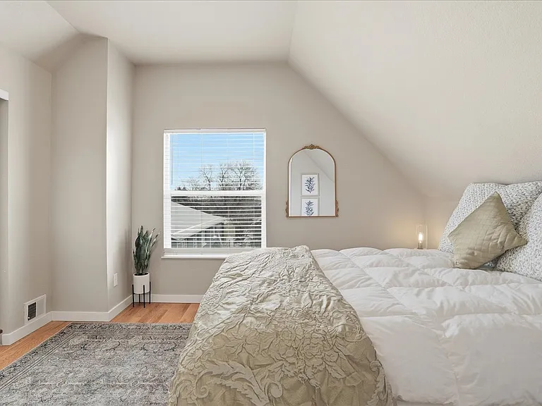 East bedroom with queen bed and large closet