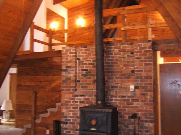 Great room with fireplace and stairs to upper level