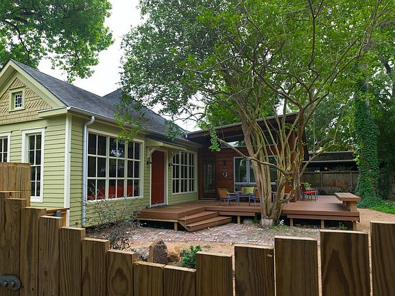 A view of the 1915 home with modern additions and the big deck