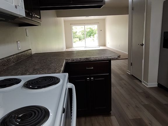 View of natural setting and lake from kitchen and livingroom