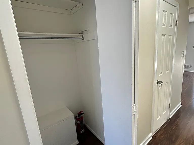Coat closet off foyer.
