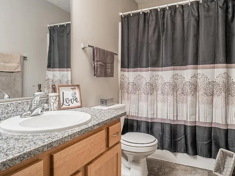 A sleek mix of updated surfaces creates bathrooms that feel brand new.