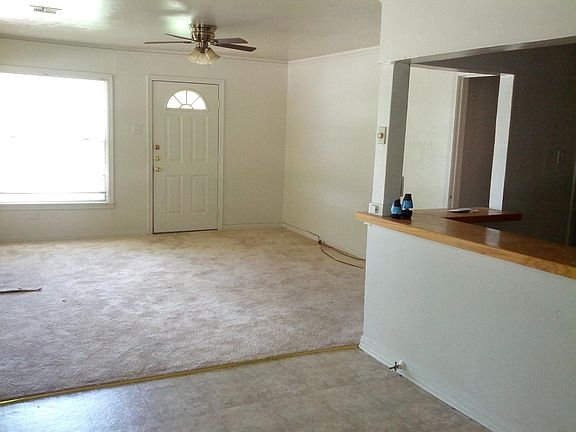 Living Room has 3 additional windows, and hardwood floors.