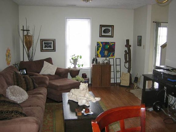 Den located off kitchen