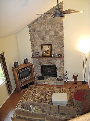 Wow, drama with a floor to ceiling stone fireplace