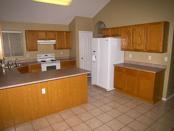 Open kitchen with full pantry