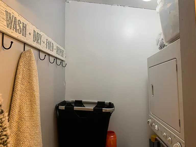 Convenient in-unit washer and dryer with additional storage space.