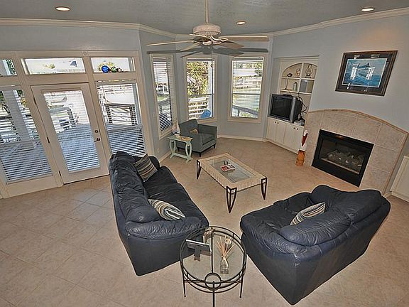 View from stairs. Wall of windows and doors offers natural lighting and amazing water views.