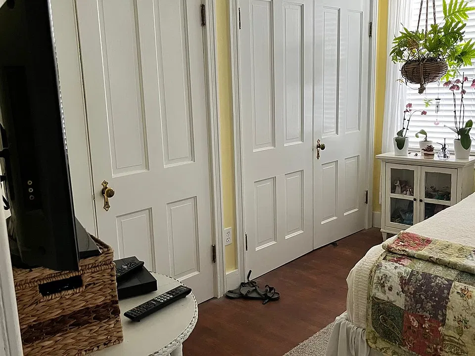 bedroom with two double door, cedar lined closets