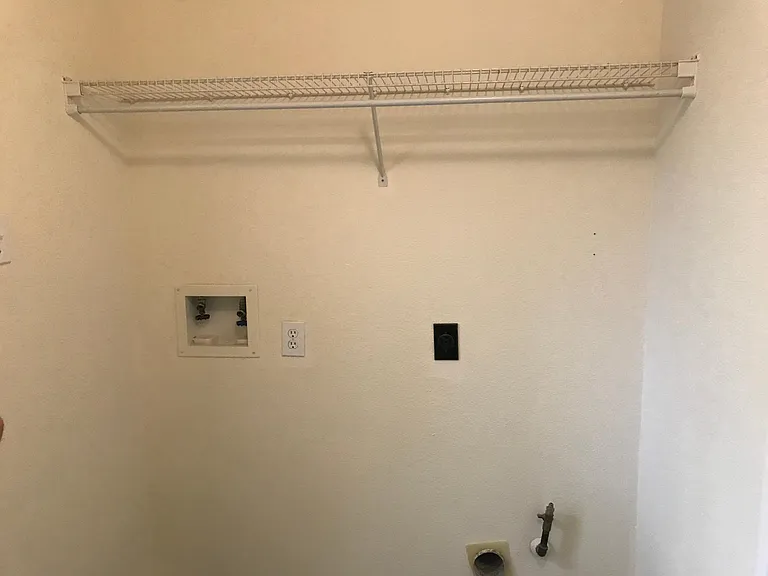 Laundry area with washer and dryer hookups