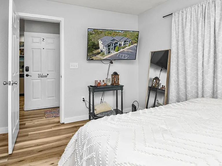 bedroom with mounted tv