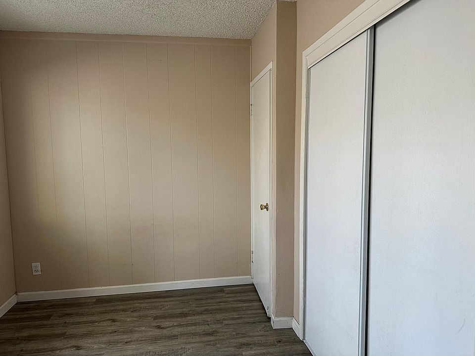 Walls have been painted white. See other pictures.This is an bedroom with patio door entrance .