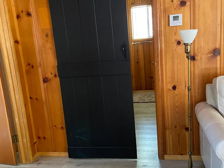 Barn door leads into private middle bedroom, 2nd bathroom and 3rd bedroom / office.