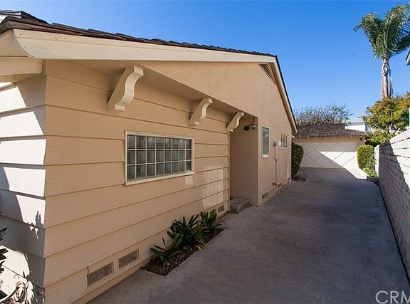 Parking is easy with a long driveway and 2 car garage.
