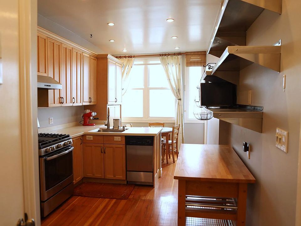 Here is a better view of the kitchen. The big pantry next to the window has plenty of storage.