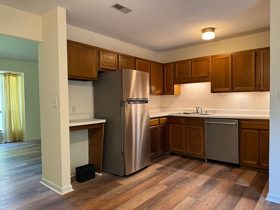 The kitchen has all new stainless steel appliances. Under-cabinet lighting. The Bosch dishwasher is silent. The range vent hood is quiet and has a light.