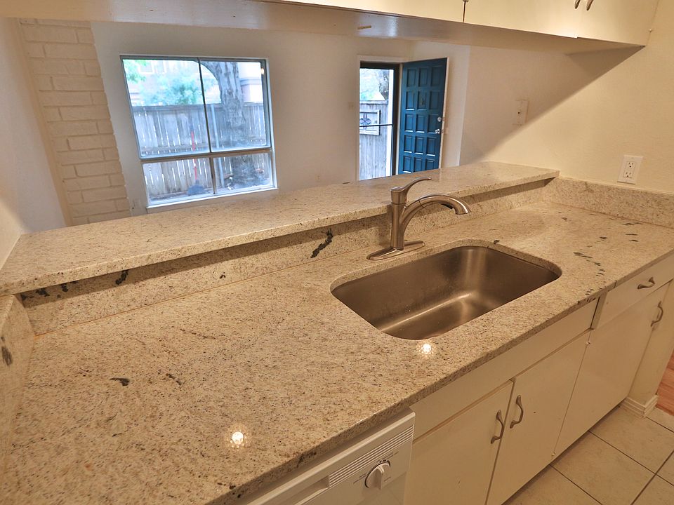 View of the living room and entrance from the kitchen.