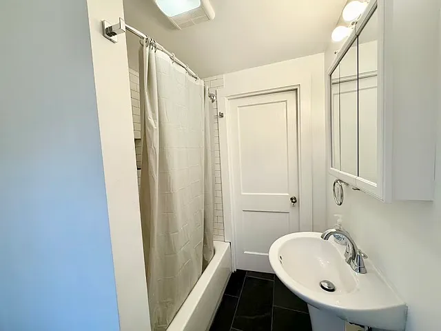 Gut-renovated bathroom with storage nook