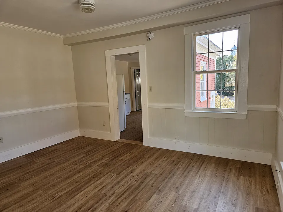 Partial view of the bedroom with door to kitchen