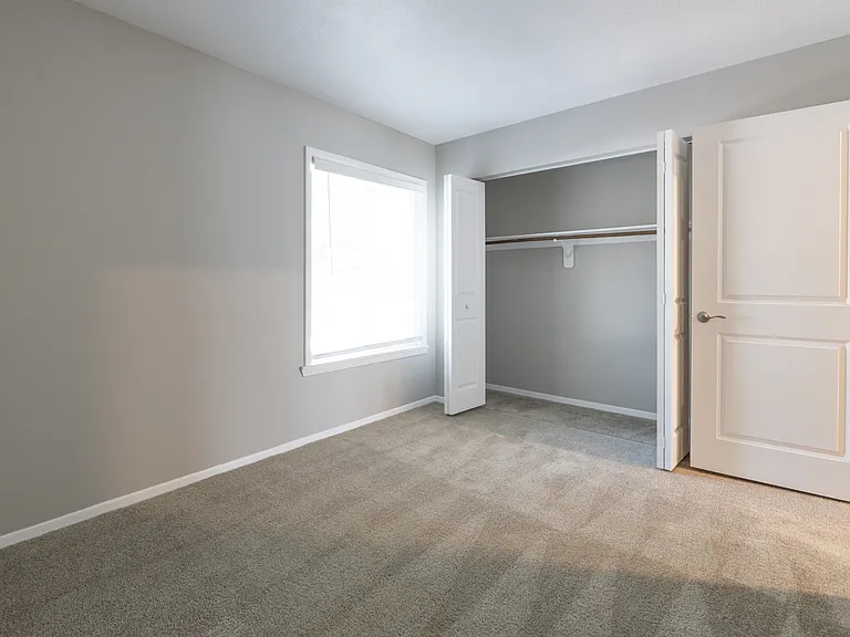 Second Bedroom with Closet in the Two Bedroom One Bath Apartment at Woodbridge Bloomington
