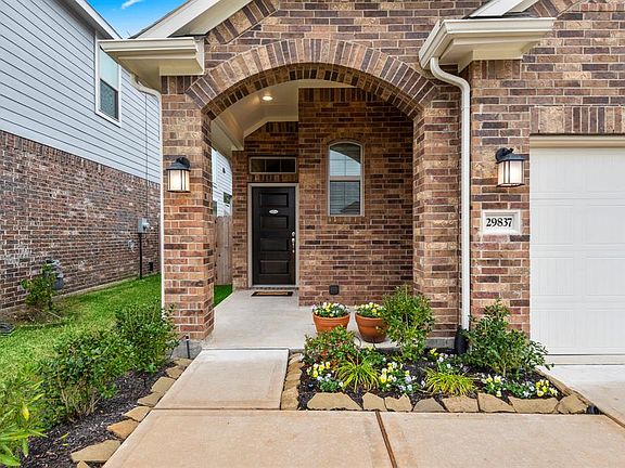 Imagine your morning coffee or a nice visit with neighbors right here on this lovely front porch. It's just the perfect spot.