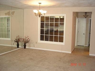 Dining area with view into kitchen