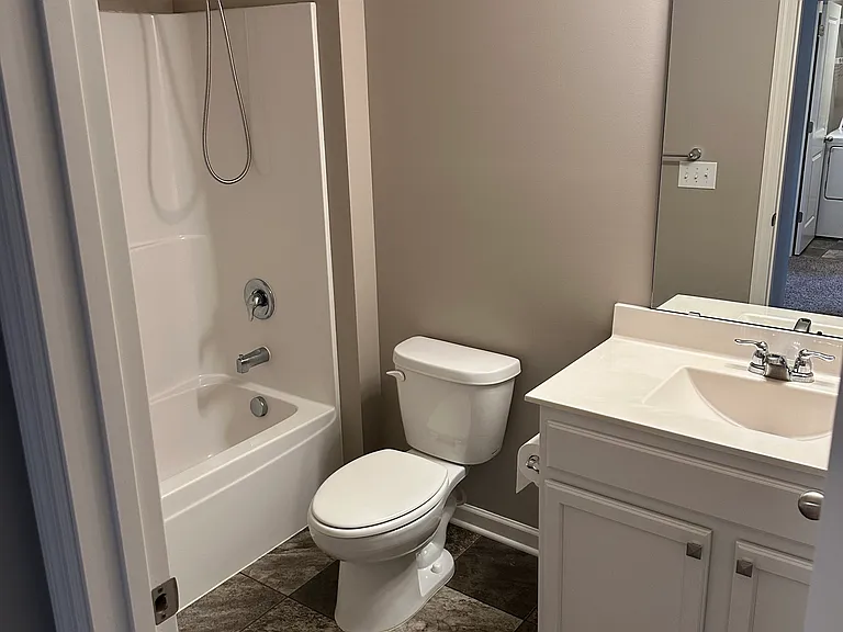 Upstairs full bathroom shared with two bedrooms.
