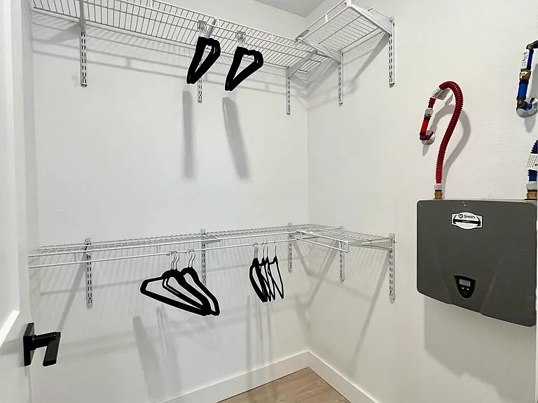 Oversize walk in closet for downstairs bedroom. Perfect for long term stays